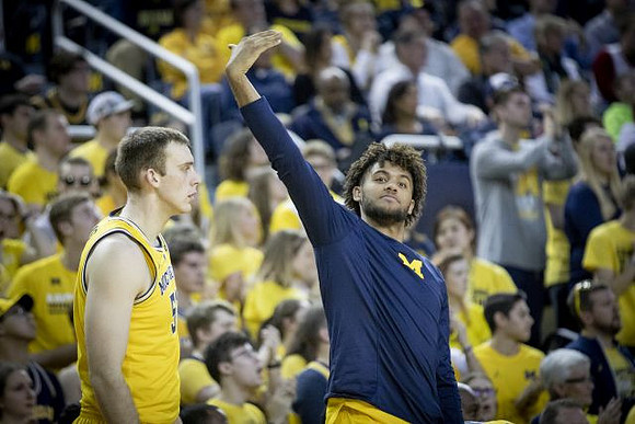 Austin Davis (51) and Isaiah Livers (4)