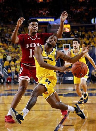Zavier Simpson (3) and Brandon Johns Jr. (23)