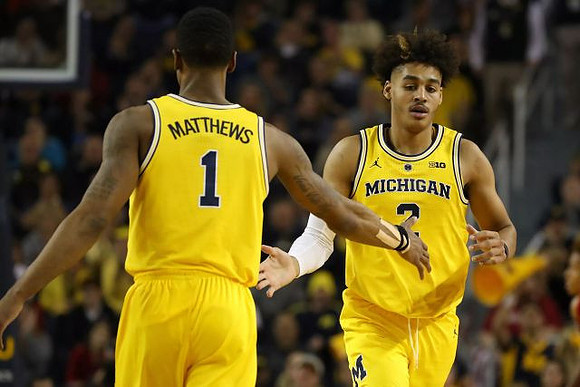 Charles Matthews (1) and Jordan Poole (2)