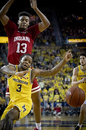 Zavier Simpson (3) and Brandon Johns Jr. (23)