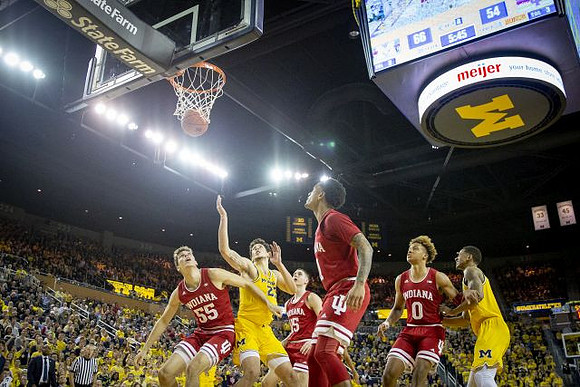 Brandon Johns Jr. (23) and Charles Matthews (1)