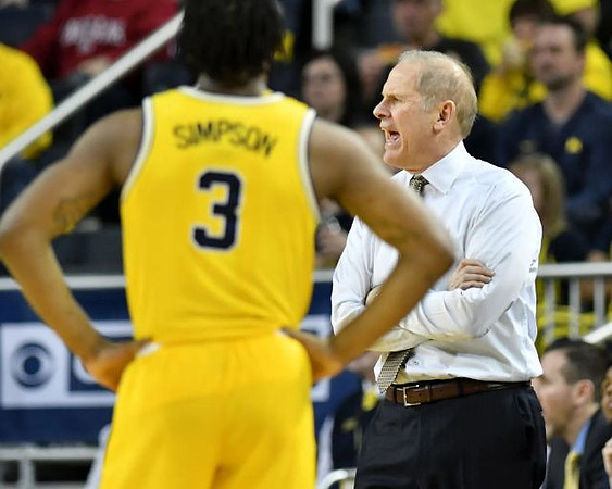 Zavier Simpson (3) and John Beilein