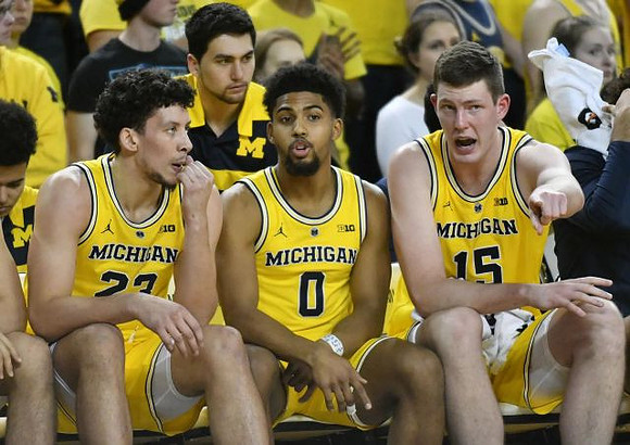 Brandon Johns Jr. (23), David DeJulius (0), and Jon Teske (15)
