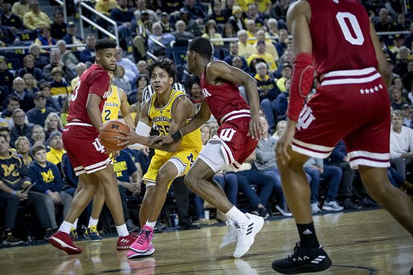 Eli Brooks (55) and Jordan Poole (2)