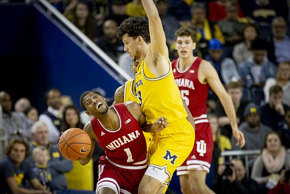 Brandon Johns Jr. (23) and Charles Matthews (1)