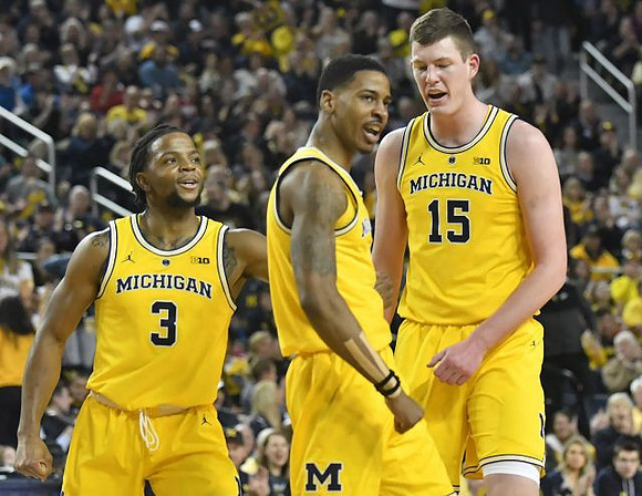 Zavier Simpson (3), Charles Matthews (1), and Jon Teske (15)