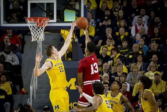 Jon Teske (15), Eli Brooks (55), Charles Matthews (1), and Jordan Poole (2)