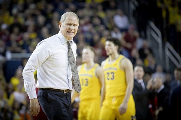 John Beilein, Ignas Brazdeikis (13), and Brandon Johns Jr. (23)