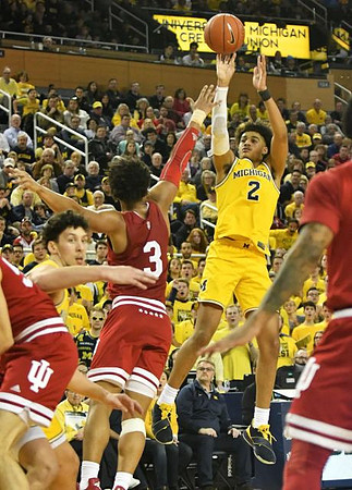 Brandon Johns Jr. (23) and Jordan Poole (2)