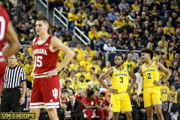 Zavier Simpson (3) and Jordan Poole (2)