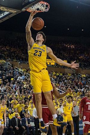 Brandon Johns Jr. (23) and Jordan Poole (2)