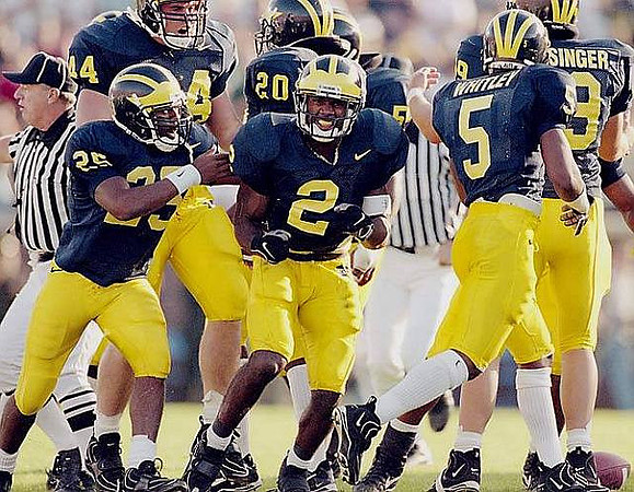 Rob Swett (44), Mike Hynes (25), Charles Woodson (2), Ian Gold (20), James Whitley (5), and Jake Frysinger (99)