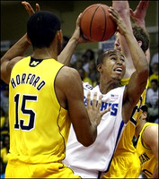 Jon Horford (15) and Evan Smotrycz (23)