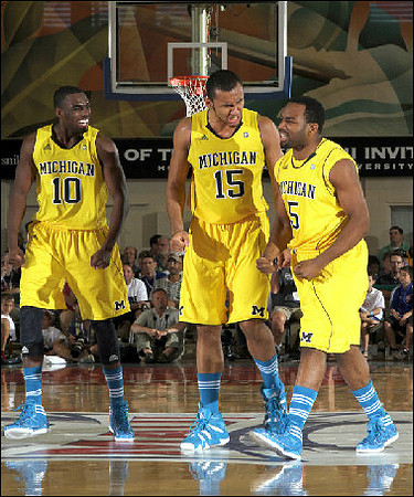 Tim Hardaway Jr. (10), Jon Horford (15), and Eso Akunne (5)