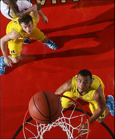 Zack Novak (0) and Jon Horford (15)