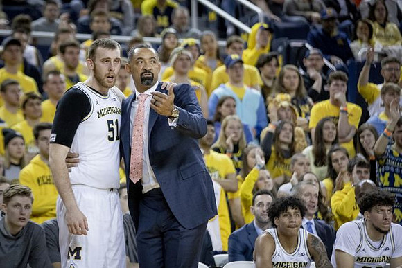 Austin Davis (51), Juwan Howard, Eli Brooks (55), and Brandon Johns Jr. (23)