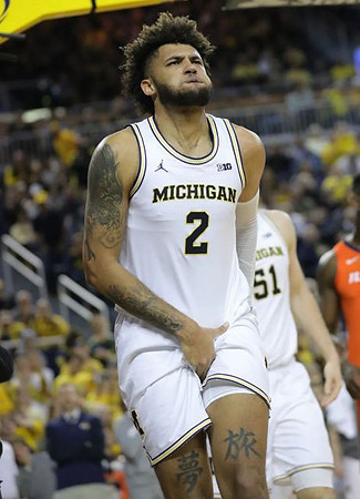 Isaiah Livers (2) and Austin Davis (51)