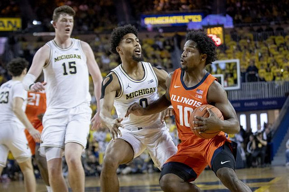 Brandon Johns Jr. (23), Jon Teske (15), and David DeJulius (0)