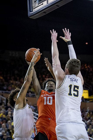 Isaiah Livers (2) and Jon Teske (15)