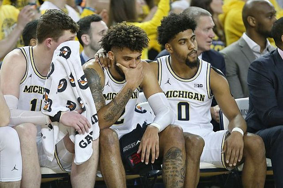 Jon Teske (15), Isaiah Livers (2), and David DeJulius (0)