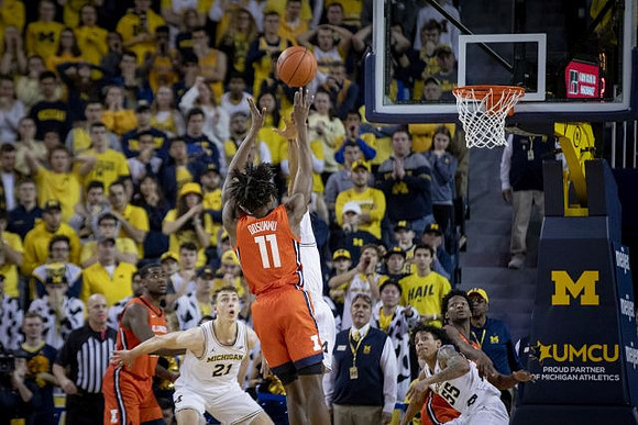 Franz Wagner (21), Zavier Simpson (3), and Eli Brooks (55)
