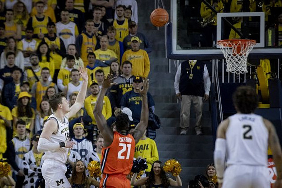 Jon Teske (15) and Isaiah Livers (2)