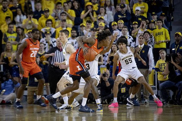 Franz Wagner (21), Zavier Simpson (3), and Eli Brooks (55)
