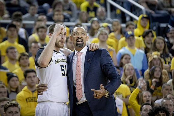 Austin Davis (51) and Juwan Howard