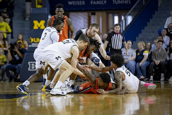 Zavier Simpson (3), Franz Wagner (21), Austin Davis (51), and Eli Brooks (55)