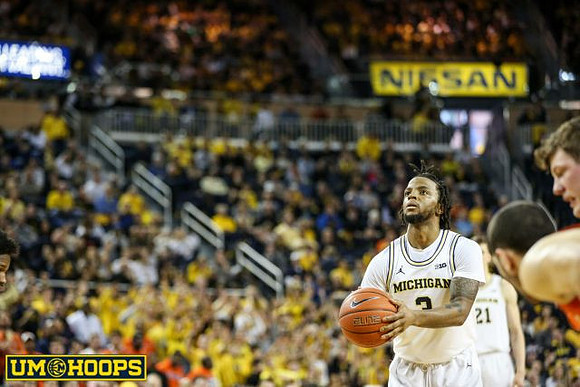 Zavier Simpson (3), Franz Wagner (21), and Jon Teske (15)