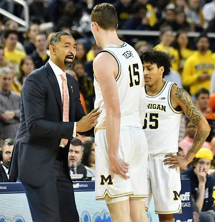 Juwan Howard, Jon Teske (15), and Eli Brooks (55)