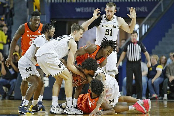 Zavier Simpson (3), Franz Wagner (21), Eli Brooks (55), and Austin Davis (51)