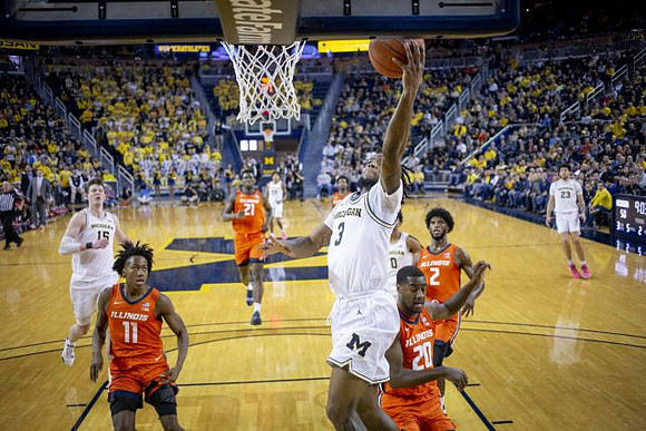 Jon Teske (15), Zavier Simpson (3), and Brandon Johns Jr. (23)