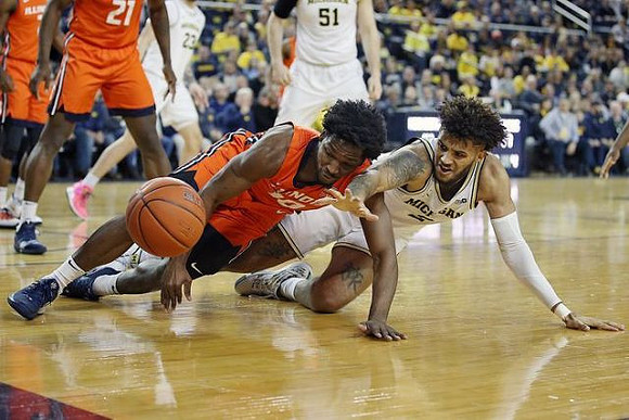 Isaiah Livers (2), Brandon Johns Jr. (23), and Austin Davis (51)