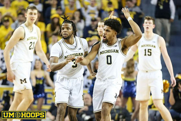 Franz Wagner (21), Zavier Simpson (3), David DeJulius (0), Austin Davis (51), and Jon Teske (15)