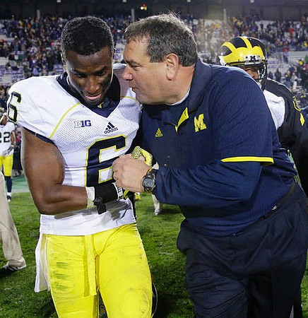 Raymon Taylor (6) and Brady Hoke