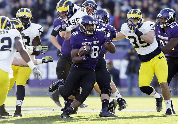 Jarrod Wilson (22), Mario Ojemudia (53), Matthew Godin (99), and Joe Bolden (35)