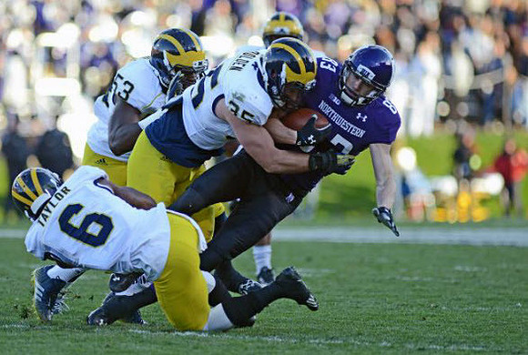 Raymon Taylor (6), Mario Ojemudia (53), and Joe Bolden (35)