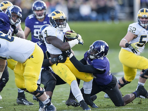 De'Veon Smith (4) and Mason Cole (52)