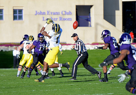 Ben Braden (71) and Devin Funchess (1)