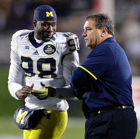 Devin Gardner (98) and Brady Hoke