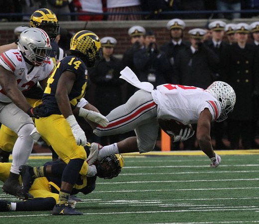 Josh Metellus (14) and Khaleke Hudson (7)