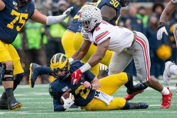 Jon Runyan Jr. (75), Shea Patterson (2), and Michael Onwenu (50)