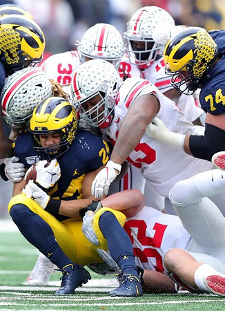 Zach Charbonnet (24) and Ben Bredeson (74)