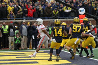 Josh Metellus (14), Daxton Hill (30), Aidan Hutchinson (97), and Lavert Hill (24)