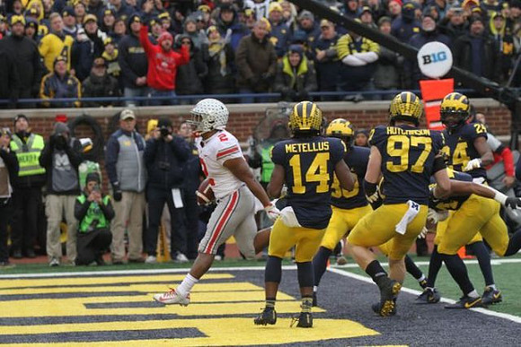 Josh Metellus (14), Daxton Hill (30), Aidan Hutchinson (97), and Lavert Hill (24)