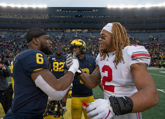 Josh Uche (6), Nick Eubanks (82), and Donovan Peoples-Jones (9)