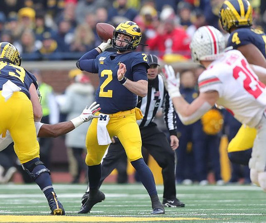 Jalen Mayfield (73), Shea Patterson (2), and Nico Collins (4)