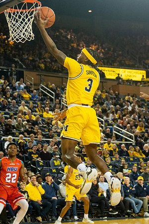 Zavier Simpson (3) and Eli Brooks (55)