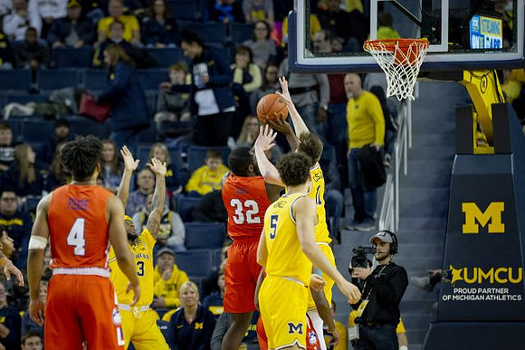 Zavier Simpson (3), Adrien Nunez (5), and Colin Castleton (11)